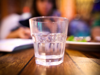 A glass glass stands on a table