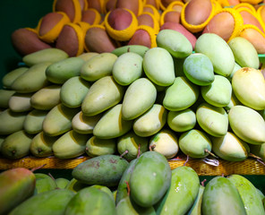 Mango on the counter in the market .