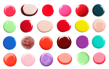 Set of different nail polishes on white background