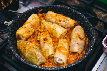 Stuffed cabbage is cooked in a pan, orange color