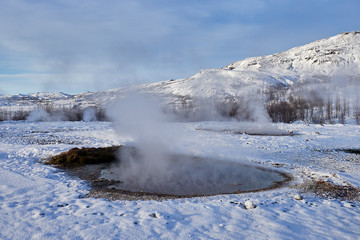 Hot water streams around Strokkur geyser, Iceland