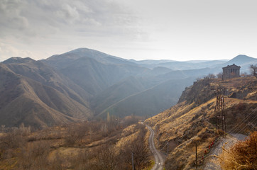 Mountain landscape in Armenia cloudy day.Caucasian Mountains. A beautiful column of the Temple of Garni.