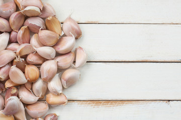 Garlic cloves on wooden background with top view,copy space.
