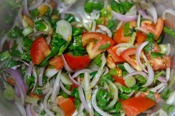 Salad with fresh tomatoes, onions, coriander leaves