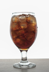 cola in a glass with ice cubes