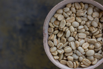 White coffee beans on old rusty background
