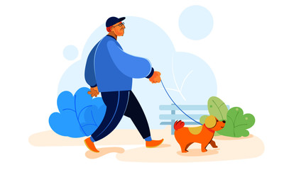 Old man walking with a pet dog in the park.