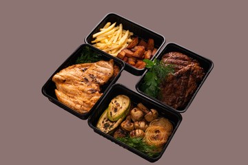 Fish steak with potatoes and vegetables shot