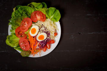Vegetables Salad on black  wooden  background