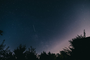 Naklejka premium Night starry sky in the village in spring