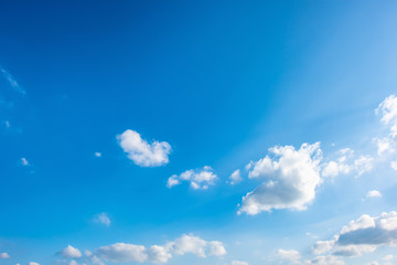 Naklejka na ściany i meble Beautiful blue summer sky with fluffy clouds as a background