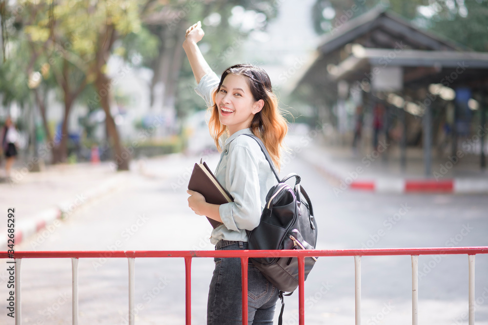 Poster Happy young Asian University student.