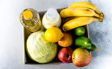 Food Delivery Box Donation Food Donation Concept. donation box with vegetables, fruits and other food for people