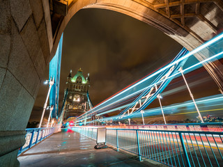 Naklejka premium London Tower Bridge night shot with London Bus light trails
