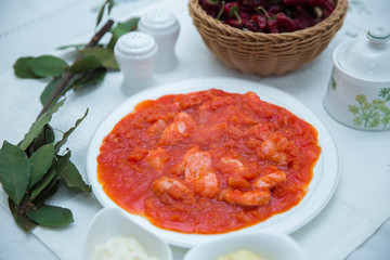 Tomato Pickle . Chicken and tomatoes . Red Dry Pepper in Traditional Basket . Tomato Pickle . Chakhokhbili - chicken stewed with tomatoes and onions. salt, pepper. Red Dry Pepper in Basket .