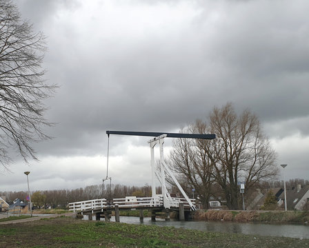 black and white wooden drawbridge over the ring canal of the Zuidplaspolder called "Witte Brug" in Nieuwerkerk aan den IJssel
