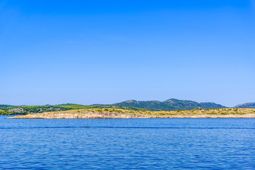 Landscape of Sea and Croatian coast, scenic view during the cruise in the Adriatic Sea with rocky beach in Croatia. Vacation and travel concept
