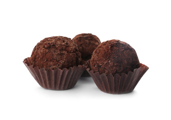 Delicious chocolate truffle candies isolated on white