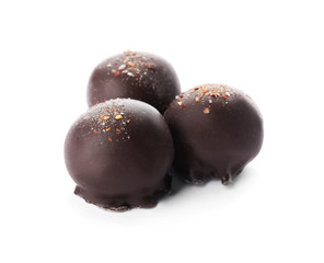 Delicious dark chocolate candies isolated on white