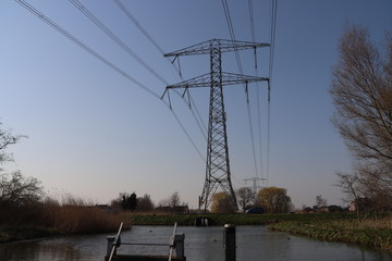 Ditches with water and electricity wires at Park Hitland between Capelle an d Nieuwerkerk aan den...