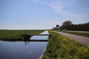Ditch with water in the Krimpenerwaard area between the meadows along road N210 at krimpen aan den...