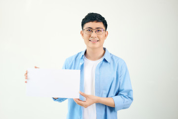 Asian young man showing pannel isolated on white background.