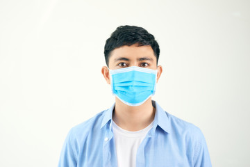 Protection against contagious disease, coronavirus. Man wearing hygienic mask to prevent infection, airborne respiratory illness such as flu, 2019-nCoV. indoor studio shot isolated on white background