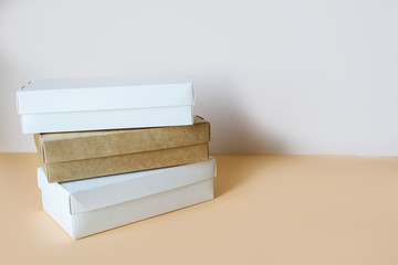 Delivery of food at home, in eco boxes and packages on a light background.