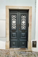 Old and colorful wooden door with iron details