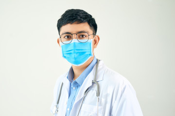 Young asian man in medical field, wearing a white coat and face mask,