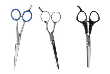 Set of different professional hairdresser scissors on white background