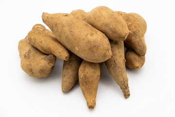 Pile of smallanthus sonchifolius or yacon or snow lotus  isolated on white background