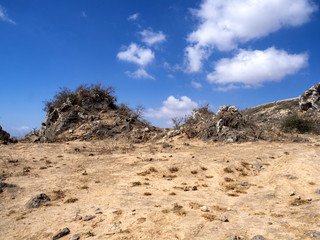 Dry bushy on the slopes in the mountains of southern Oman