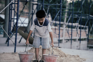 Children are forced to work in the construction area. Human rights concepts stop child abuse, violence, fear and child labor.
