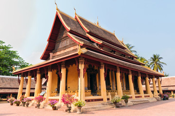Naklejka premium Exterior of Buddhist wat Si Saket in Vientiane in Laos against blue sky