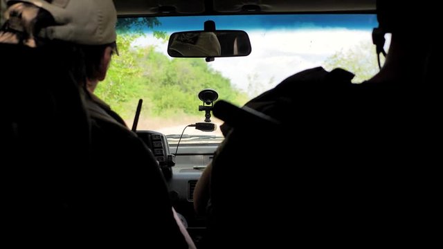 Airsoft. On a mountain road in a jeep ride armed men, soldiers