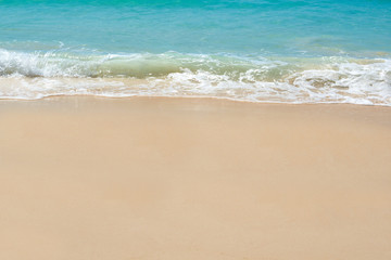 Obraz na płótnie Canvas Blue sea and wave on clear sandy beach Background.