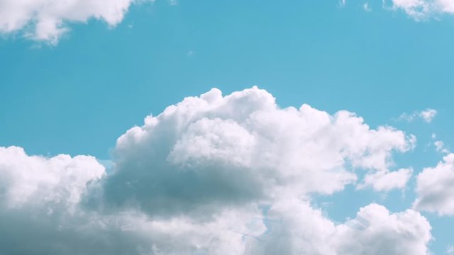 Motions clouds. Puffy fluffy beautiful white clouds sky time lapse. Slow moving clouds.