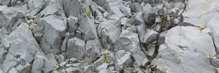 Detail of natural rough stone, rippled rock background