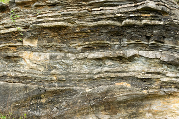 Detail of natural rough stone, rippled rock background