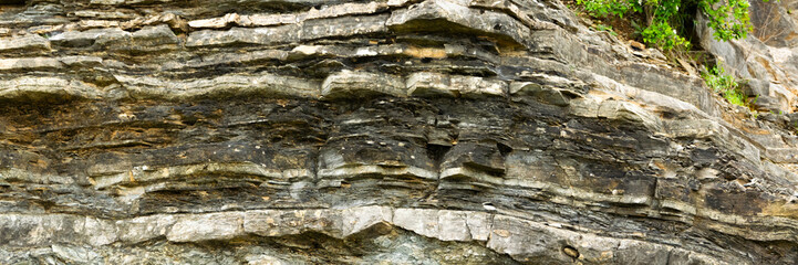 Detail of natural rough stone, rippled rock background