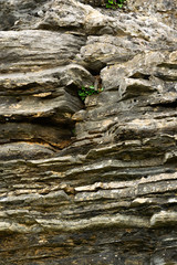 Detail of natural rough stone, rippled rock background