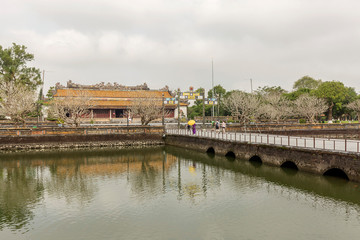 Wonderful view of the “ Meridian Gate Hue “ to the Imperial City with the Purple Forbidden City within the Citadel in Hue, Vietnam. Imperial Royal Palace of Nguyen dynasty in Hue. Hue is a popular 
