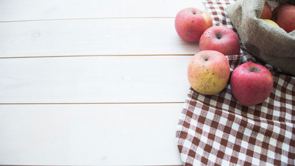 ripe apples on a wooden background