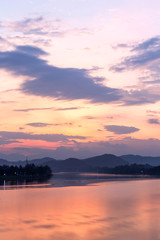 Fototapeta na wymiar Beautiful sunset in Huong River, in Hue city, Vietnam Unesco World Heritage Site