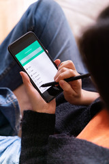 Social distance and coronavirus covid - 19 concept. Unrecognizable woman doing online shopping from the house. Groceries application to buy food and stay home during pandemic time.