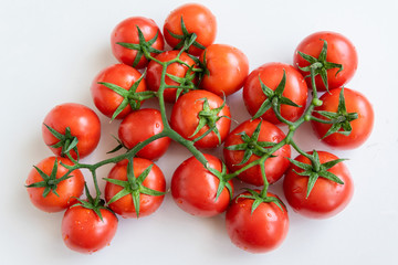Healthy food ingredient - raw tomatoes on white background, vibrant colours, vitamin food, space for text
