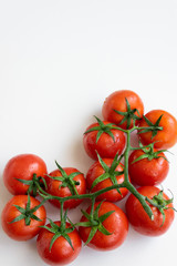 Healthy food ingredient - raw tomatoes on white background, vibrant colours, vitamin food, space for text