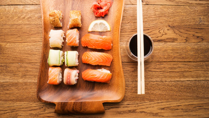 Set of sushi and maki roll on stone table. Top view with copy space