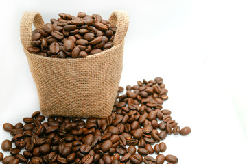 coffee beans in a vintage sack on isolated white background, top view